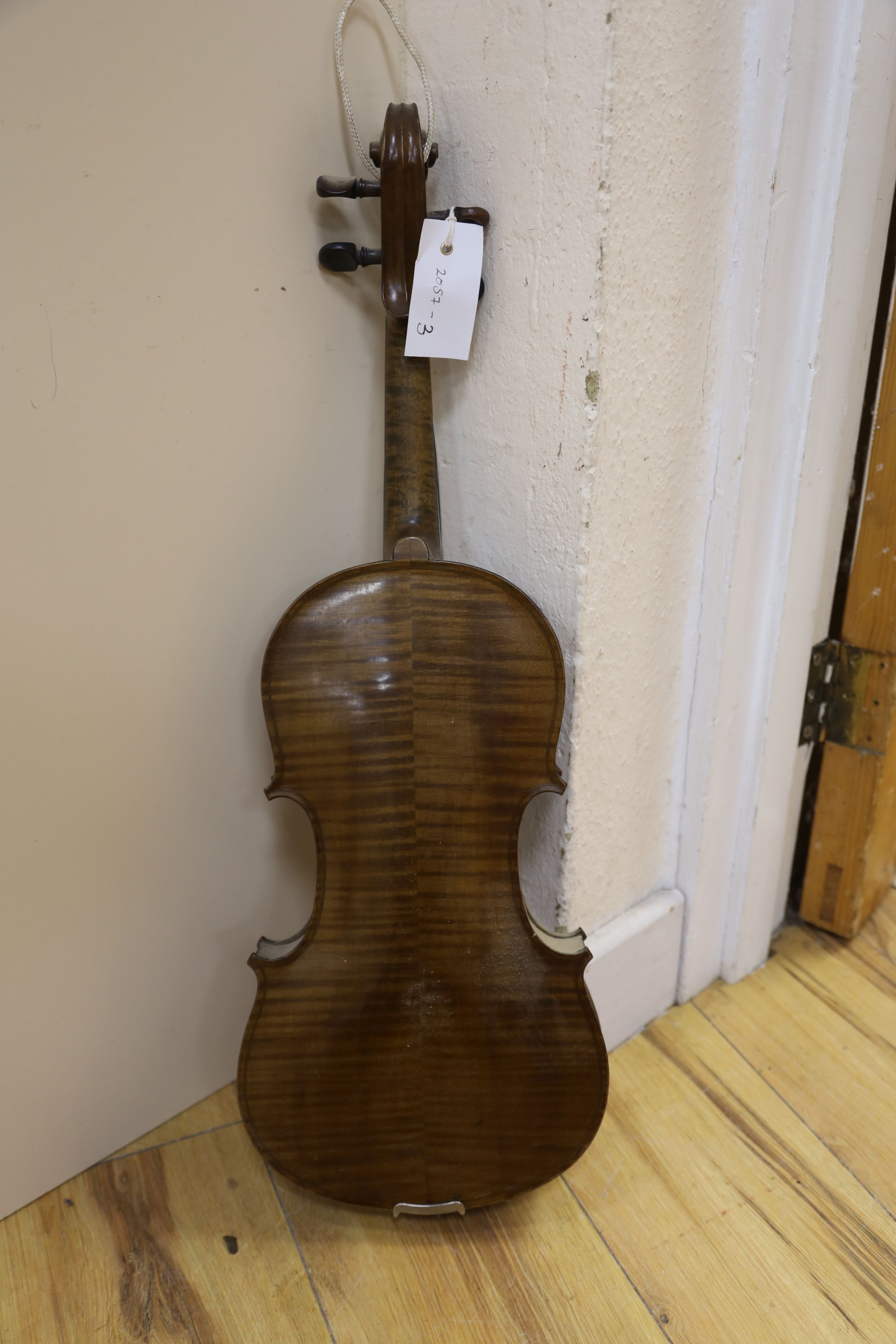 A violin labelled Francesco Ruggeri and a bow. Back of violin excluding button - 36cm